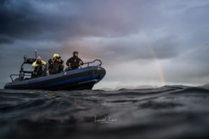 zodiac milpro hurricane cz7 boat with diver onboard and rainbow